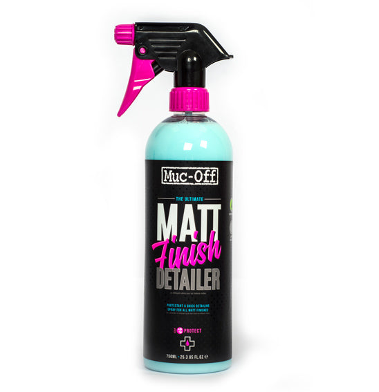 A spray bottle of Muc-Off Matt Finish Detailer - NEW! from MUC OFF, labeled "The Ultimate Matt Finish Detailer," provides a protective finish for satin matt paints. The 750 ml (25.4 fl oz) bottle showcases a sleek design with black and pink accents, including text and a pink nozzle.
