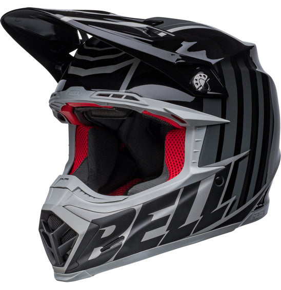 Introducing the Bell MOTO-9S FLEX Sprint Matte/Gloss Black/Grey: a sleek off-road racing helmet with silver accents and an aggressive design. This safety-focused helmet features a visor, angular lines, and prominently displays the BELL brand on the side. It is ideal for off-road and motocross activities.