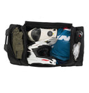 The OGIO CRAWLER Gear Bag - Black is a large wheeled gear bag featuring off-road wheels, a retractable handle, side straps, and a spacious main compartment. It is shown upright and slightly angled to the right.