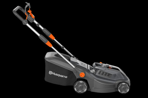 Image of a Husqvarna Aspire™ L34 Lawn Mower (Kit) with an 18V battery. The black mower, accented in orange, features a sleek design and a grass collection bag at the back. With the POWER FOR ALL battery system, its handlebar is adjustable and foldable for easy storage.