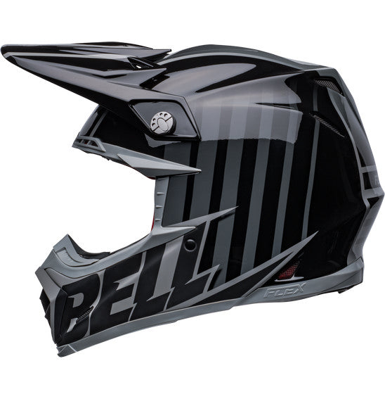 Introducing the Bell MOTO-9S FLEX Sprint Matte/Gloss Black/Grey: a sleek off-road racing helmet with silver accents and an aggressive design. This safety-focused helmet features a visor, angular lines, and prominently displays the BELL brand on the side. It is ideal for off-road and motocross activities.