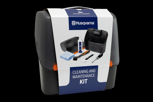 Introducing the Husqvarna Automower Cleaning and Maintenance Kit: This all-inclusive set comes complete with a plastic container, grey dustpan, blue cloth, cleaning spray bottle, handheld brush, small white block, scraper tool, and screwdriver. Perfect for maintaining your Husqvarna automower with ease and keeping it in top condition.