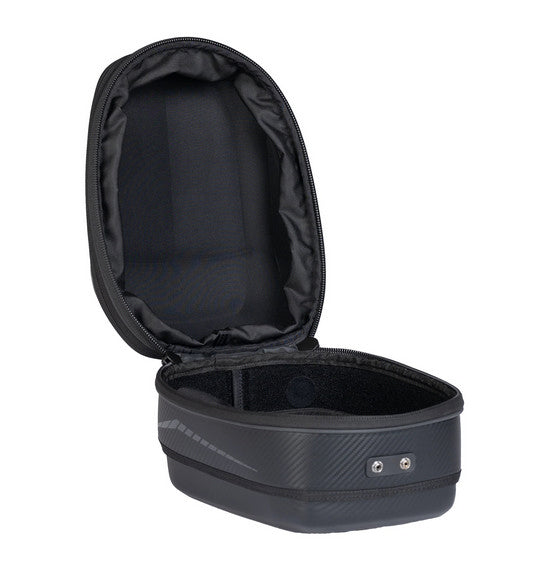 An open view of the OGIO TB1 TAIL BAG 14L - Ram Mount, a small black rectangular hardshell case, reveals an interior lined with soft padded material for protection. The exterior showcases its textured finish and two metal rivets on the front, with a zipper running along the edge.