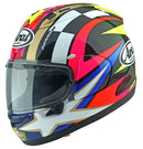 A side view of a colorful motorcycle helmet with intricate patterns in black, white, red, yellow, and blue. The Arai RX-7V EVO - Schwantz 30 prominently displays the number 74 and the ARAI brand logo on its side. This Kevin Schwantz Helmet features a clear visor and a sleek, aerodynamic design that meets ECE R22-06 standards.