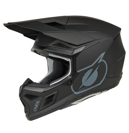 The O'Neal 2025 Youth 3SRS SOLID Helmet in black features a stylish design with silver accents, a large adjustable visor, and robust Polycarbonate/ABS shell. This ONEAL helmet includes a ventilation system for comfort and displays the brand logo on the side, offering both safety and style for off-road biking.