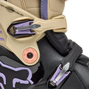 The FOX 180 HELLO FUTURE BOOTS from FOX feature beige, black, and pastel accents, a high-top design with multiple buckles, bold branding, a purple logo, and "HELLO FUTURE" on the strap—rugged durability meets future style.