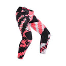 The FOX 180 DIGI IMAGE PANTS feature a pink, black, and white geometric camo design, black knee panels, and a FOX logo on the thigh—built for dirt bike riders seeking comfort and mobility in the Rider Attack Position. Displayed on a white background.
