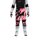 The FOX 180 DIGI IMAGE PANTS feature a pink, black, and white geometric camo design, black knee panels, and a FOX logo on the thigh—built for dirt bike riders seeking comfort and mobility in the Rider Attack Position. Displayed on a white background.
