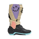 The FOX 180 HELLO FUTURE BOOTS from FOX feature beige, black, and pastel accents, a high-top design with multiple buckles, bold branding, a purple logo, and "HELLO FUTURE" on the strap—rugged durability meets future style.