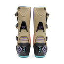 The FOX 180 HELLO FUTURE BOOTS from FOX feature beige, black, and pastel accents, a high-top design with multiple buckles, bold branding, a purple logo, and "HELLO FUTURE" on the strap—rugged durability meets future style.