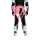 The FOX 180 DIGI IMAGE PANTS feature a pink, black, and white geometric camo design, black knee panels, and a FOX logo on the thigh—built for dirt bike riders seeking comfort and mobility in the Rider Attack Position. Displayed on a white background.