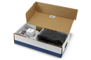 An image of a spool of black loop wire accompanied by several small black plastic stakes and pairs of blue and red connectors scattered nearby on a white background, resembling components from the Husqvarna Automower® Installation Kit by Husqvarna.