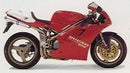 The Ventura EVO-12 Bike-Pack Kit for Ducati 916 S, SP (1995) includes a black EVO-12 pack, Evo-Rack Adjustable Pack-Rack mounted on the bike, and an L-bracket with hardware. All labeled items are shown on a white background.