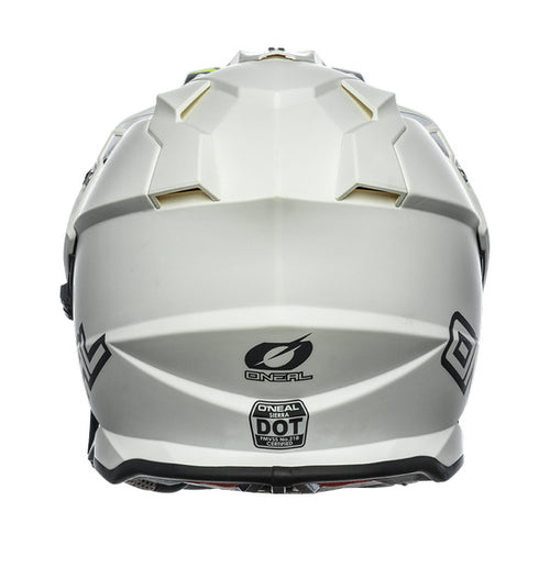 The front view of the O'Neal SIERRA Helmet R V.23 in Flat White showcases its angular design and geometric patterns. Designed by ONEAL, this stylish helmet is perfect for adventure bikes, featuring an integrated face shield, a small visor, and prominent branding—ideal for both safety and style.