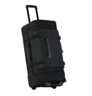 The OGIO CRAWLER Gear Bag - Black is a large wheeled gear bag featuring off-road wheels, a retractable handle, side straps, and a spacious main compartment. It is shown upright and slightly angled to the right.