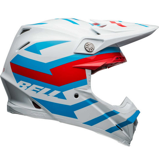 The Bell MOTO-9S FLEX Banshee Gloss White/Red is a safety-focused, full-face motocross helmet adorned with a striking blue, red, and white geometric design. It features a visor, multiple ventilation openings, and the brand name "BELL" in blue on the side. The interior padding is visible around the face opening, making it perfect for off-road racing.