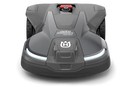 The image shows a Husqvarna Automower® 450X NERA robotic lawn mower. It features a sleek, gray and black design with LED headlights, large rubber wheels, and a red power button. The Husqvarna logo and model name are visible on the body. Integrated with object avoidance and compatible with the Automower Connect app.