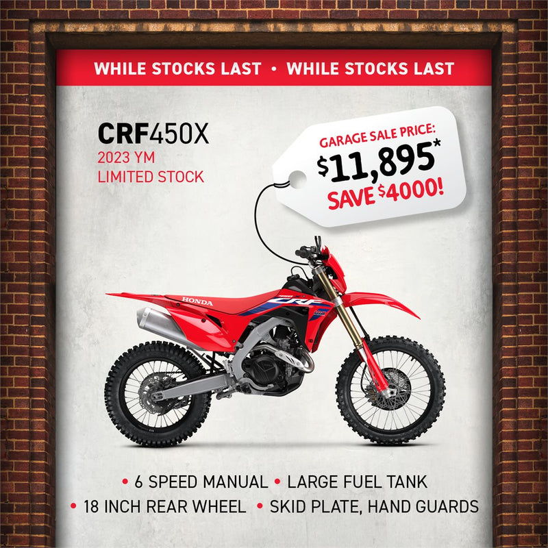 Advertisement for the 2024 Honda CRF450X with a powerful Unicam engine, 6-speed manual, large fuel tank, 18-inch rear wheel, skid plate, and handguards. Pictured against a brick wall with "While Stocks Last." Now only $11,895—save $4,000. Ideal for off-road competition!.