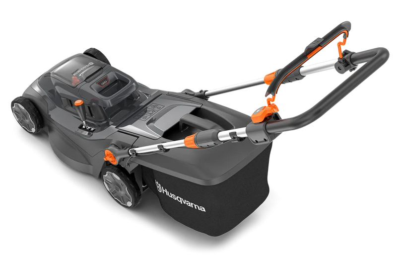 Image of a Husqvarna Aspire™ L34 Lawn Mower (Kit) with an 18V battery. The black mower, accented in orange, features a sleek design and a grass collection bag at the back. With the POWER FOR ALL battery system, its handlebar is adjustable and foldable for easy storage.