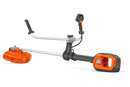 A professional-grade Husqvarna 525iRXT Brushcutter (skin) in orange and silver, featuring a long straight shaft and a protective guard over the cutting blade. The dual handles at the mid-section ensure optimal control, while the powerful motor unit is mounted at the bottom, perfect for forestry tasks.