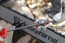 The Husqvarna File Handle - Suits Round and Flat File is expertly crafted with an ergonomic design and three central slits, making it ideal for comfortably carrying multiple tools at once. It features the word "Push" embossed at one end, set against a black background that highlights its patented file locking system.