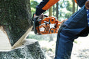 A HUSQVARNA 562XP-20 Chainsaw with an orange and gray body, ideal for forestry and gardens. The chainsaw features a long silver blade marked with "Husqvarna" and "X-Force." The machine has a sturdy handle and appears to be suited for heavy-duty cutting tasks.