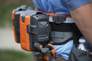 A Husqvarna Battery belt FLEXI with multiple compartments, designed to hold and power various outdoor tools. The belt features adjustable straps, two main orange battery holders, a black pouch on the left, and a connected power module on the right—perfect for maintaining lawns efficiently.
