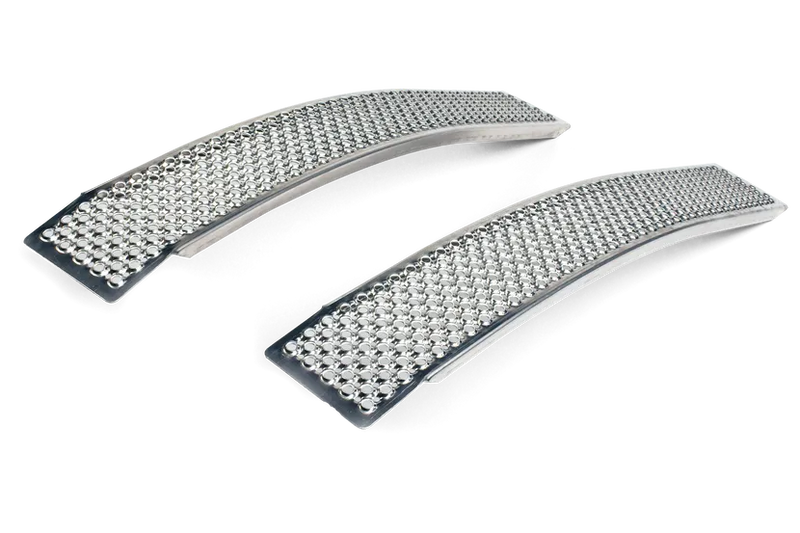 Two curved Husqvarna Curved Loading Ramps in a sleek silver finish are made of durable sea water-resistant aluminum and feature tiny, glittering bead-like embellishments. The ramps are displayed side by side on a white background, with the beads adding a textured, sparkling effect.