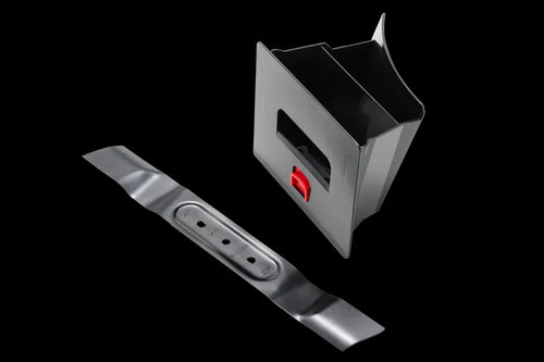 A Husqvarna Mulch plug in black plastic with an opening on the side and a red button, accompanied by a long black Husqvarna combi blade featuring holes for fitting into the container. The products are displayed on a white background.