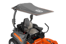 This Husqvarna Zero Turn lawn mower showcases an orange base, a black seat with steering controls, and a grey sun canopy supported by metal brackets above the seat. Both the body and the canopy prominently display the "Husqvarna" brand.