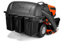 A close-up view of a Husqvarna TS Series Lawn Tractor equipped with a 48" 3 Bin Collector labeled "Super Capacity." The attachment includes three black bags for grass clippings. The orange mower, featuring a Clear Cut™ Deck, is accented in black and fitted with large, rugged tires.