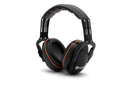 The Husqvarna Premium Earmuff with Headband features black over-ear cups adorned with silver accents and orange lining. Designed as hearing protectors, it has an adjustable headband with a padded cushion on top for optimal ergonomics during prolonged use. The Husqvarna logo is prominently displayed on the outer side of one ear cup.