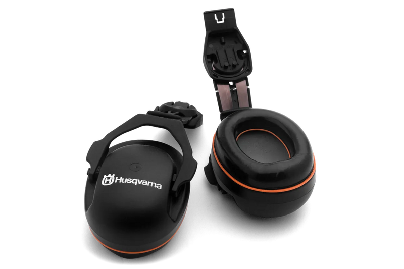 A pair of black Husqvarna H200 and Alveo hearing protectors for helmet mounts, featuring an orange accent. One earmuff is displayed upright showcasing the Husqvarna logo, while the other, equipped with a unique polyurethane insert, is laid horizontally revealing its soft cushioning interior. These lightweight over-ear protectors are designed to provide optimal hearing protection.