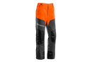 A pair of **Husqvarna Classic Waist trousers** designed for chainsaw use, featuring chainsaw protection. The trousers are primarily orange at the top and grey at the bottom, with reinforced black patches on the knees and lower legs for added durability. Perfect workwear twill for demanding tasks.