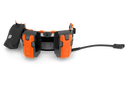 A black Husqvarna Battery Adapter with an LCD display and a connected power cord, ideal for outdoor use. The adapter's robust, compact design ensures efficient battery charging for various Husqvarna tools, perfect for maintaining gardens and lawns. The power cord features a connector at the end.