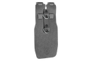 The Husqvarna Tape Measure Holder by Husqvarna is a black holster with two metal loop attachments, designed to carry tools or devices such as a tape measure. It features a textured surface and a clip for securely fastening it onto belts or straps. The holster has a rugged build and appears to be made of durable material.