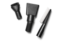 A set of three black attachments from the Husqvarna Vacuum Cleaning Nozzle Kit elegantly displayed on a white background. The Husqvarna kit includes a round brush head, a flat nozzle, and a crevice tool with an integrated brush, each featuring a sleek black design typical of household vacuum accessories or tools for cleaning vehicles.