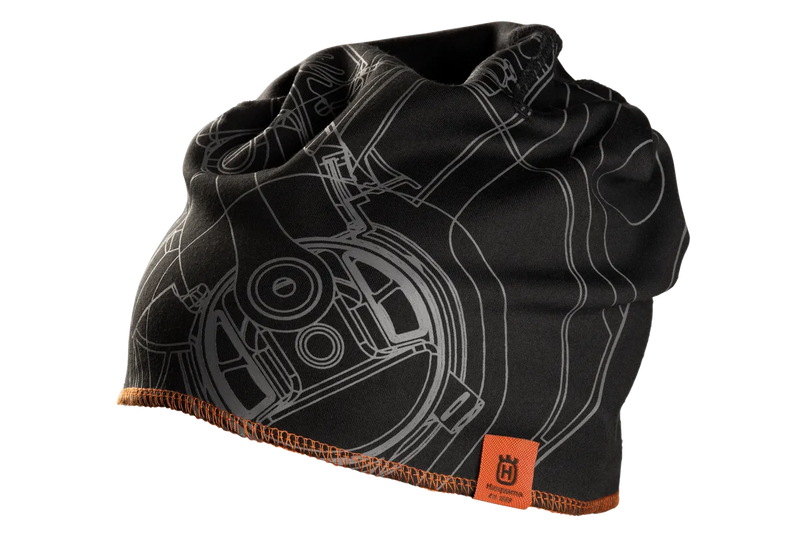 The Husqvarna Xplorer Beanie pioneer saw is a black beanie with an intricate grey mechanical drawing design, complemented by an orange hem and a tag that features the Husqvarna logo and illegible text. Made from Coolmax air material, this soft and stretchy fabric makes it perfect for cold weather.