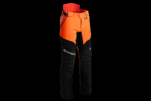 A pair of Husqvarna Arbor Waist trousers, Technical Extreme, in orange and black with attached suspenders designed for climbing and working in trees. These trousers feature multiple pockets, reinforced knee areas, and adjustable straps branded with "Husqvarna." The rugged design offers safety, agility, and functionality for demanding tasks.