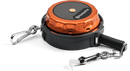 The Husqvarna Measuring Tape with a release hook - 20m combines practicality and style, featuring a metallic orange and black reel unit reminiscent of a retractable chainsaw lanyard. One end boasts a carabiner clip, while the other is equipped with a chain segment that includes an additional release hook and a small attachment tool.