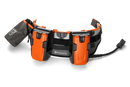 A Husqvarna Battery belt FLEXI with multiple compartments, designed to hold and power various outdoor tools. The belt features adjustable straps, two main orange battery holders, a black pouch on the left, and a connected power module on the right—perfect for maintaining lawns efficiently.
