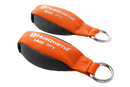 An orange and black Husqvarna Throw Weight, branded with "Husqvarna 12 oz 340g" in white text, features a metal ring at one end for easy attachment. Its exterior is crafted from durable Cordura fabric, ensuring high tensile strength.
