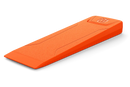 The Husqvarna Polyamide Felling Wedge - 5" / 14cm is an orange wedge made of durable polyamide material. It features a textured surface, an embossed Husqvarna logo on one end, and a simple rectangular shape with angled edges for ease of use in forestry, directional felling, and preventing timber pinching.