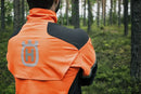 The Husqvarna Technical Forest Jacket is an orange and black outdoor jacket with a high collar and multiple panels. Made from four-way stretch polyester, it features a prominent white Husqvarna logo on the right chest and arm. The jacket includes ventilation openings and reflective strips for added visibility, making it sleek, functional, and ideal for forestry work.