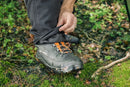 A pair of **Husqvarna Classic Waist trousers** designed for chainsaw use, featuring chainsaw protection. The trousers are primarily orange at the top and grey at the bottom, with reinforced black patches on the knees and lower legs for added durability. Perfect workwear twill for demanding tasks.