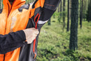 The Husqvarna Technical Forest Jacket is an orange and black outdoor jacket with a high collar and multiple panels. Made from four-way stretch polyester, it features a prominent white Husqvarna logo on the right chest and arm. The jacket includes ventilation openings and reflective strips for added visibility, making it sleek, functional, and ideal for forestry work.