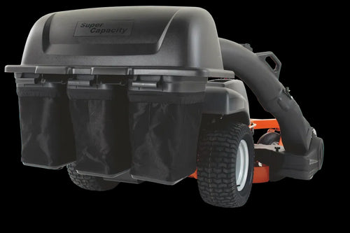 A Husqvarna ZTR® Zero Turn mower equipped with a black "Super Capacity" Triple Bin Collection System featuring a blower. The system includes three separate nylon bags for collecting grass clippings, and the mower has sturdy, large treaded tires.