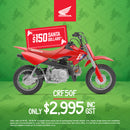 The Honda CRF50F kids bike, featuring a red frame accented with blue and white graphics, sports a small, lightweight build equipped with knobby tires for off-road adventures. The design includes a visible exhaust pipe towards the rear and components like an adjustable throttle, seat, and handlebars tailored for young riders.