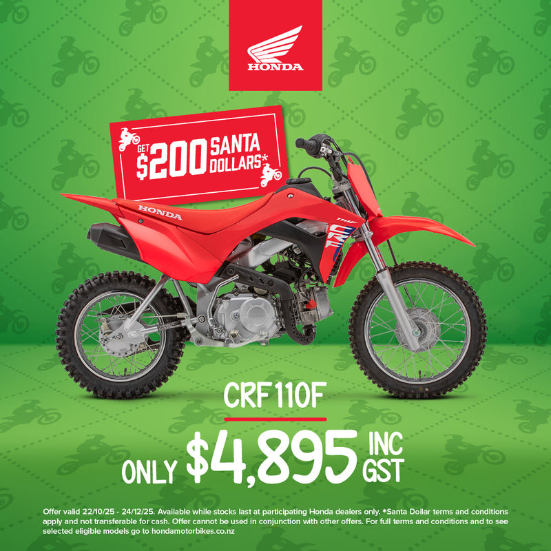 The Honda CRF110F dirt bike by Honda is displayed in a side profile view, showcasing its red body with blue and white accents. It comes with knobby tires, a black seat, and a compact design equipped with Keihin electronic fuel injection and clutch-less transmission, making it ideal for off-road riding.