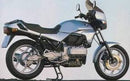The image of the Ventura EVO-12 Bike-Pack Kit for the BMW K 75 RT, S (1986) displays a black EVO-12 pack, an adjustable Evo-Rack for a motorcycle, and an L-Bracket with screws, each clearly labeled.